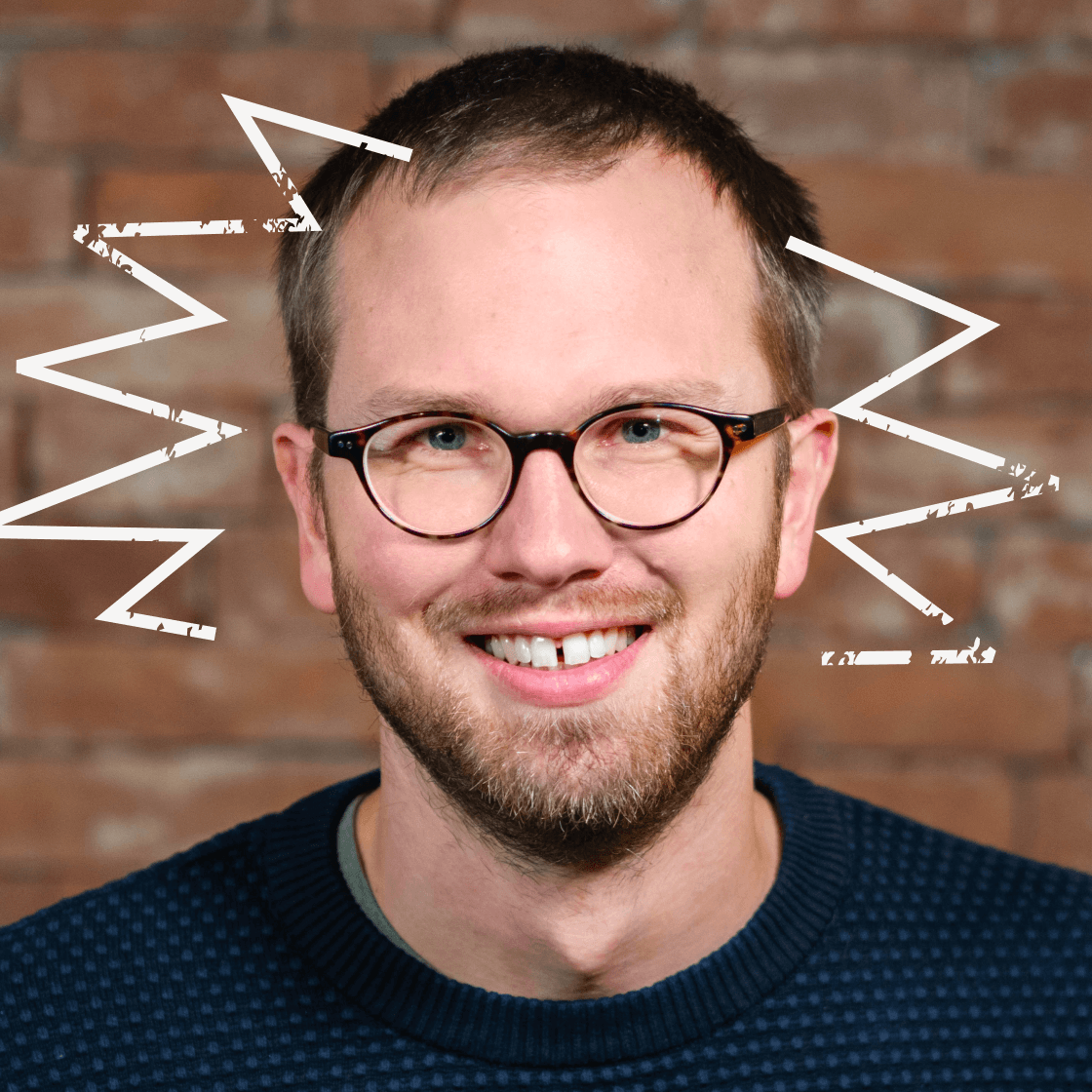 Zackenförmige Strahlen umranden Jans Kopf.