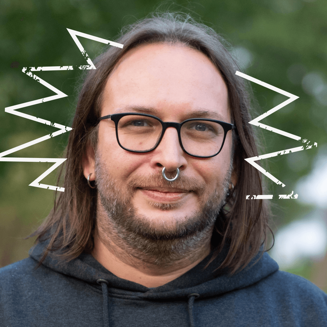 Zackenförmige, illustrierte Strahlen umranden Roberts Kopf.